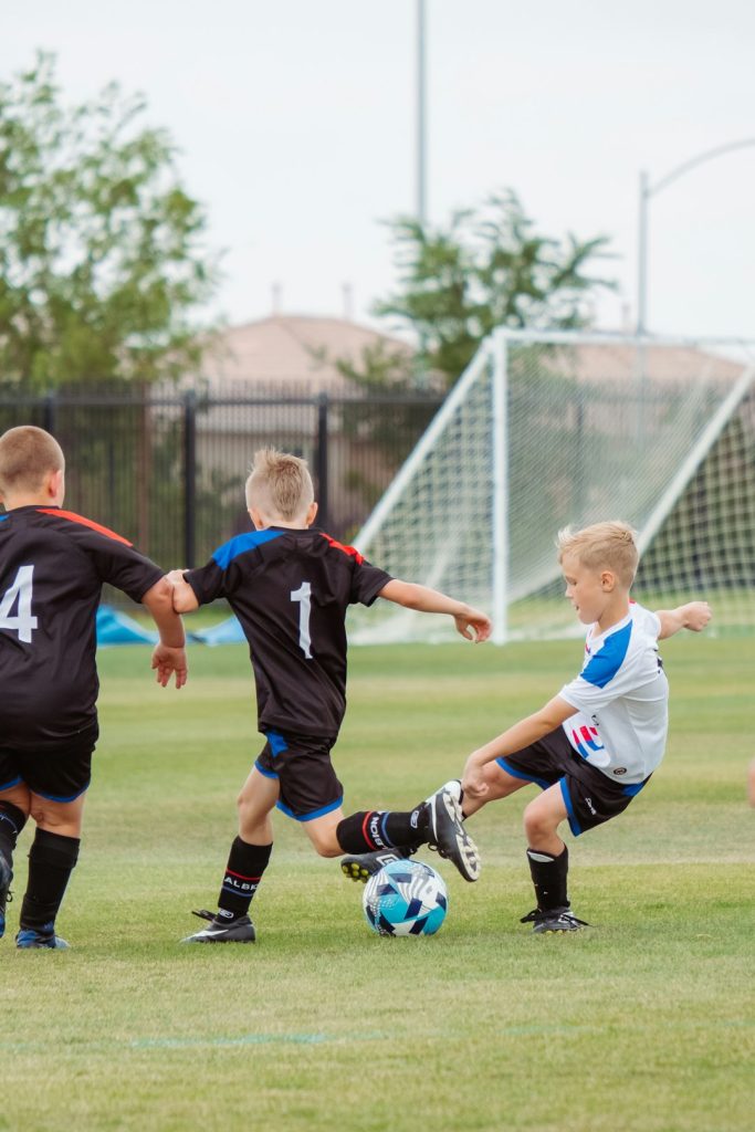 2-men-playing-soccer-during-daytime-avcbdbr-lwc